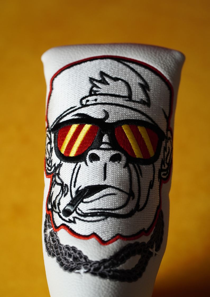 Putter headcover design of a gorilla wearing sunglasses and a cap on a white background