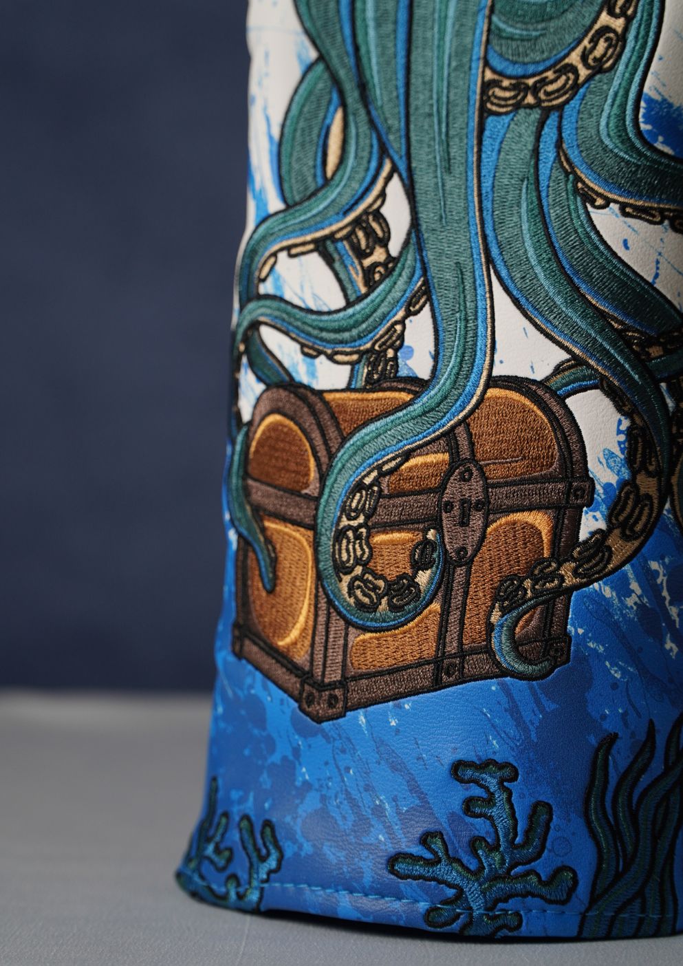 Decorative golf headcover with ocean-themed design featuring an octopus and treasure chest.