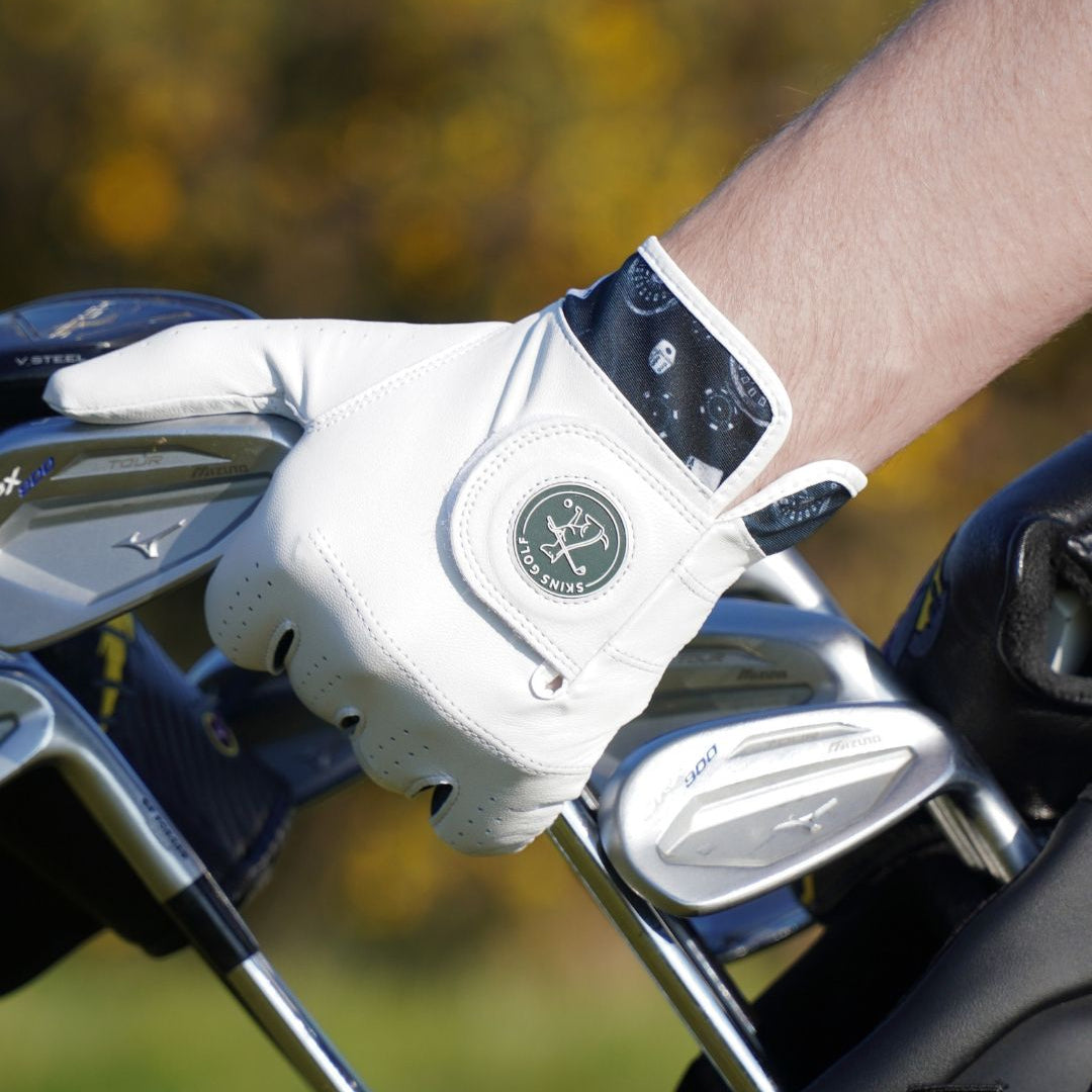 Golf club with a white glove on a blurred golf course background