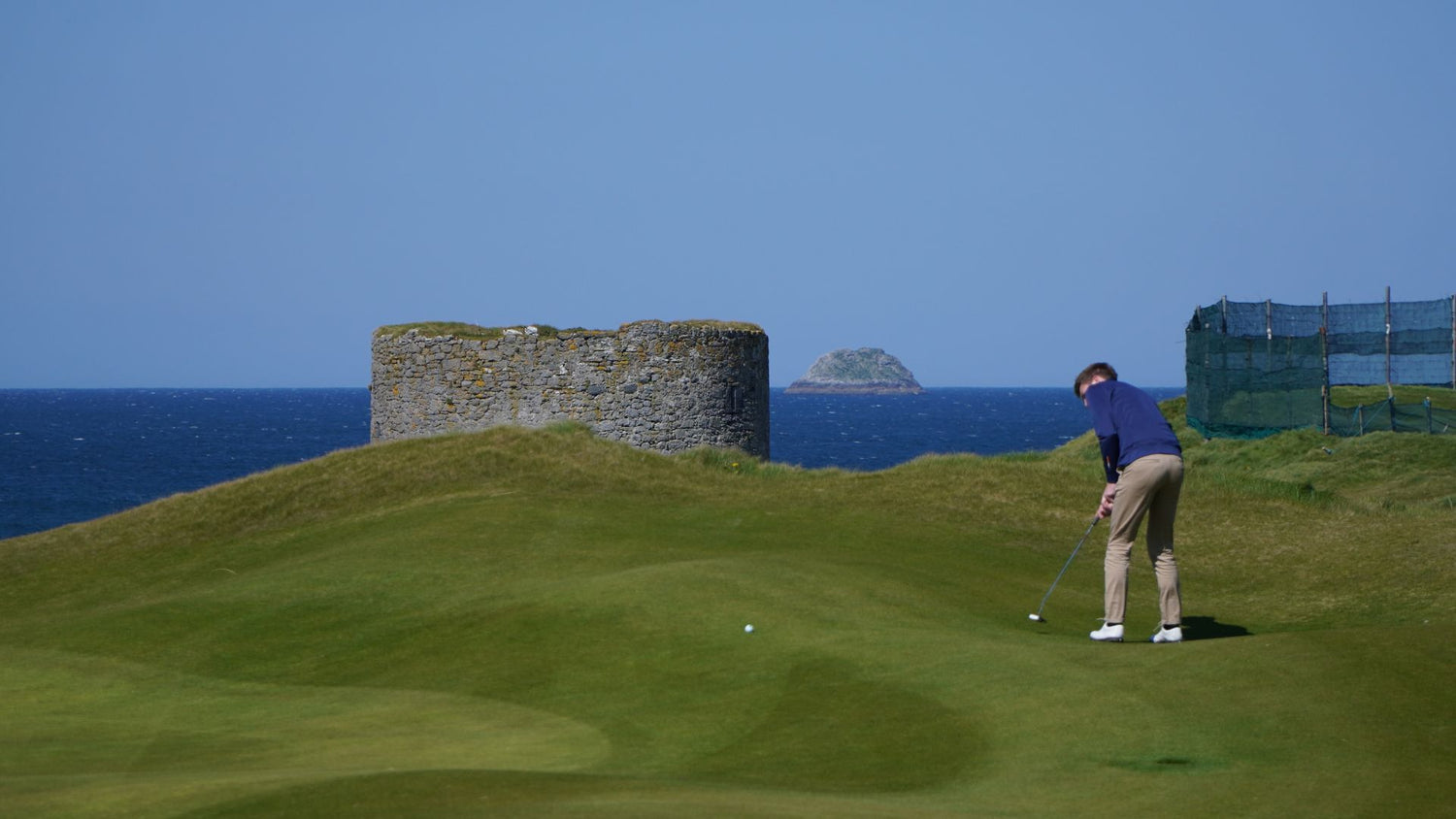 Golfer putting ball