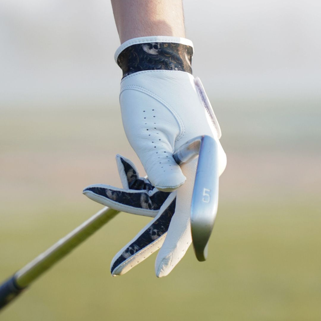 Golf glove on a blurred golf course background