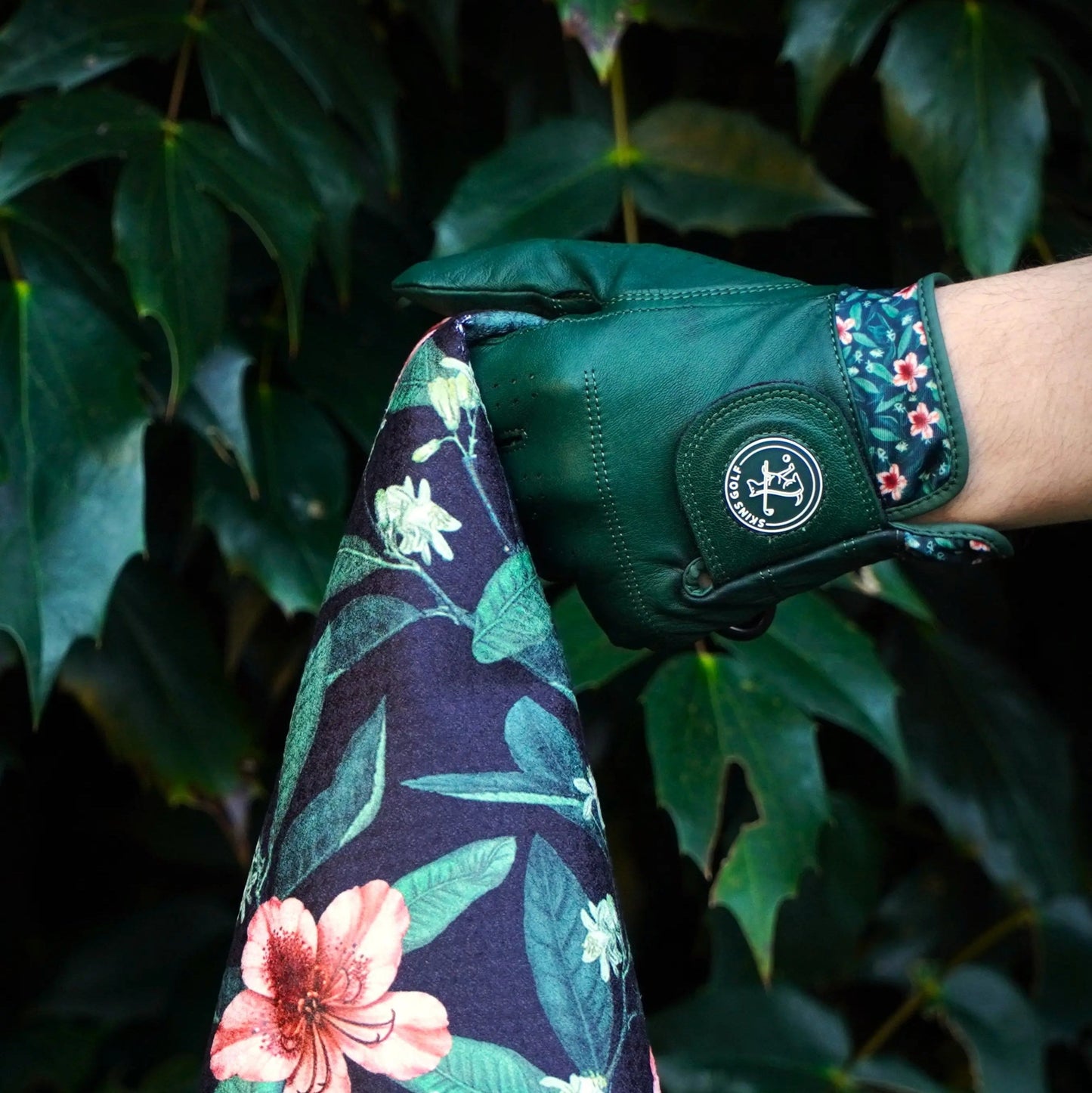 green golf glove and towel