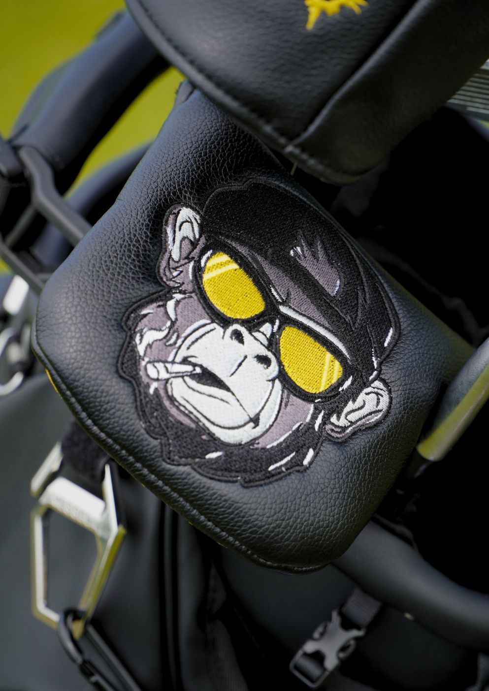 Golf mallet headcover with a graphic of a gorilla wearing sunglasses.
