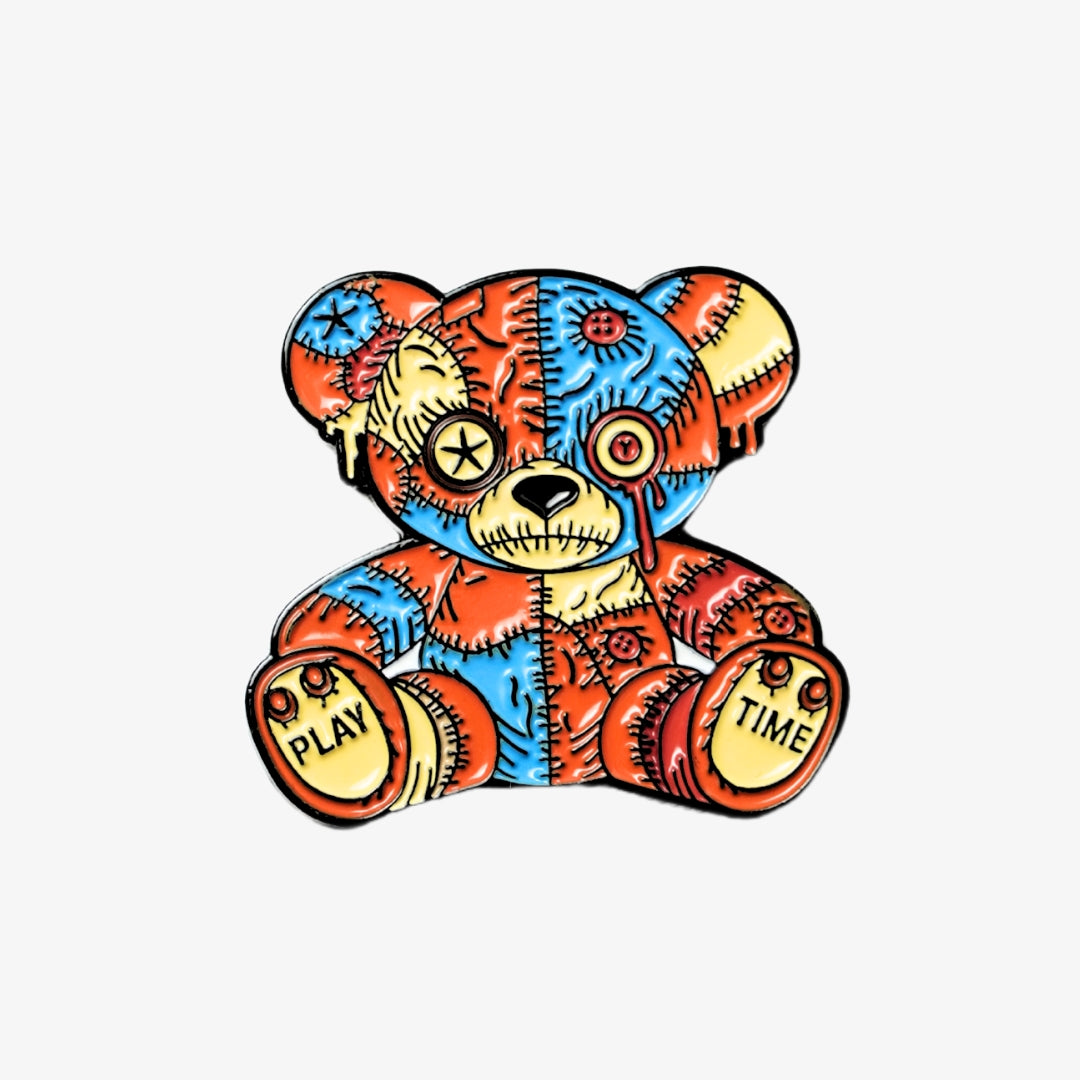 Colorful voodoo bear golf ball marker on a white background