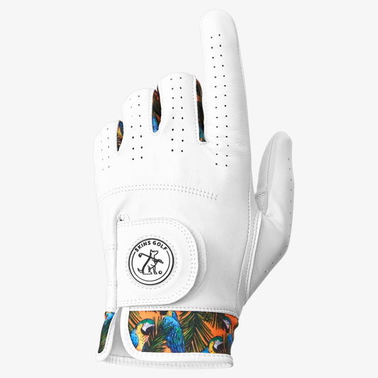 A white golf glove with a colorful pattern on the wrist and multiple small holes for breathability on the palm side.