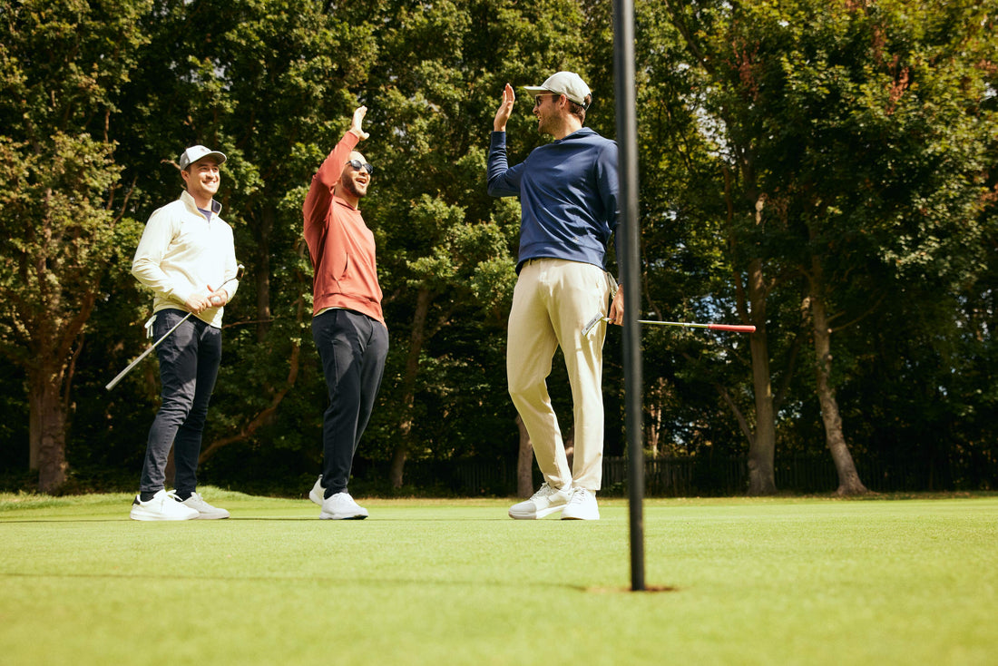 Golfers wearing golf apparel celebrating