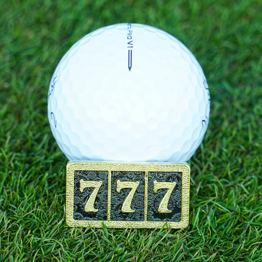 golf ball marker with 777 in gold
