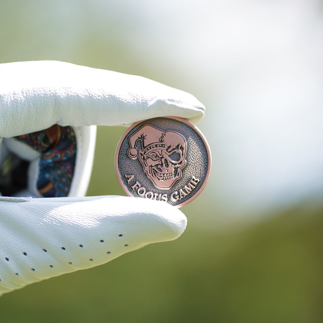 Cool golf ball marker in copper
