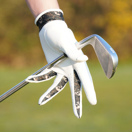 white golf glove with skull design between fingers