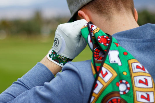 Golfer holding a casino themed golf towel