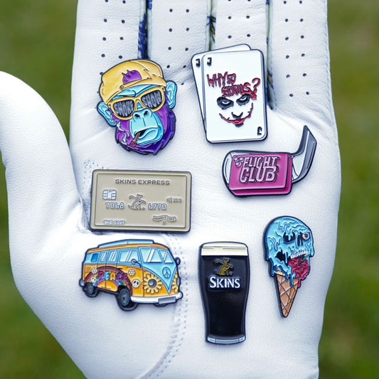 Golf ball markers on a golf glove