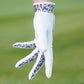Golf glove with detailed design in between the fingers