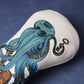 Decorative golf head cover with an octopus design on a blue background