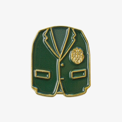 Golf ball marker in the shape of a green blazer with gold accents on a white background