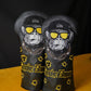 Two golf club head covers with monkey design and 'Smoke Show' branding on a black background.