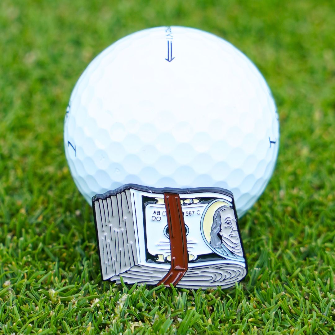 Golf ball marker with cash design