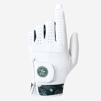 White golf glove with a skins golf logo on a light gray background