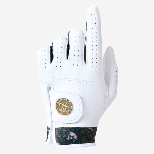 White golf glove with a skins golf logo on a light gray background