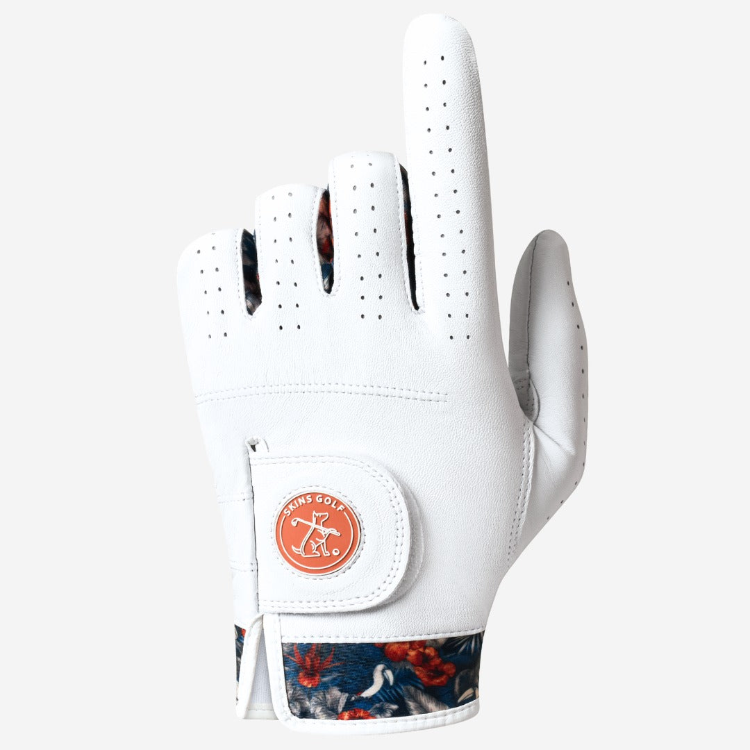 White golf glove with floral pattern on the wristband on a light gray background