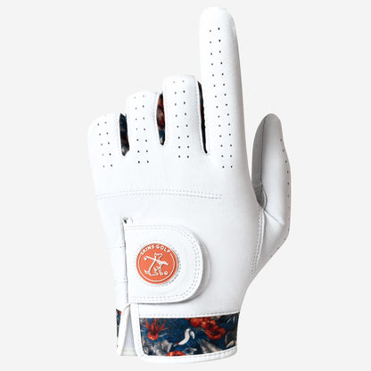 White golf glove with floral pattern on the wristband on a light gray background