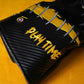 Black golf headcover for driver on yellow background