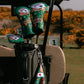 Golf club covers with casino designs on a golf cart