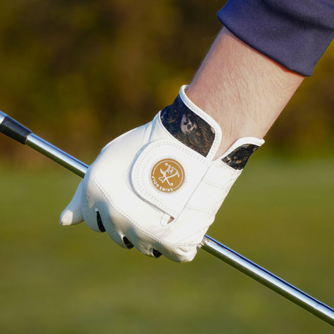 Golf glove with a brand logo on a blurred golf course background