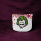 White mallet headcover with Joker design on a purple background
