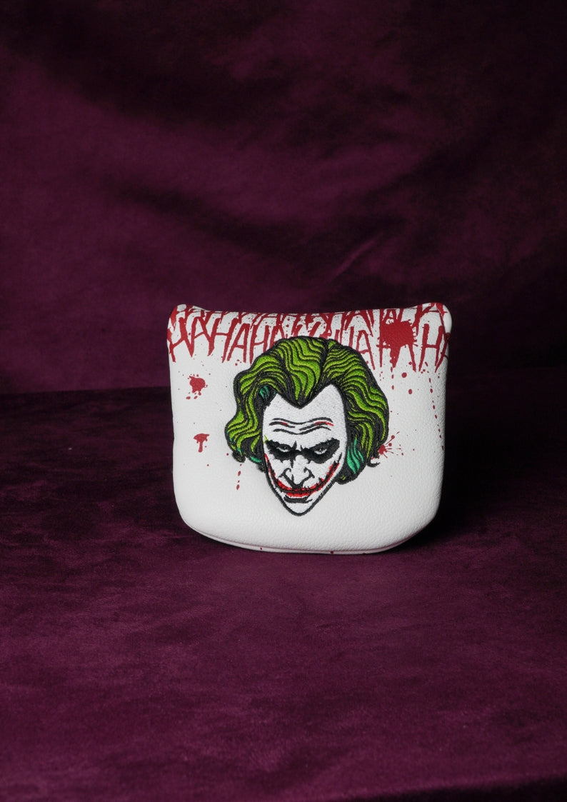 White mallet headcover with Joker design on a purple background