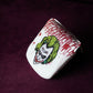 Golf headcover with a graphic design on a dark purple background