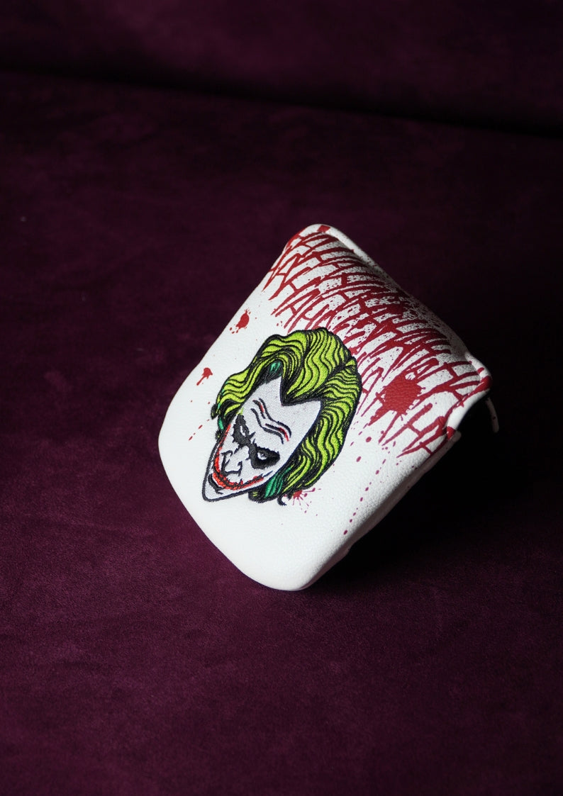 Golf headcover with a graphic design on a dark purple background
