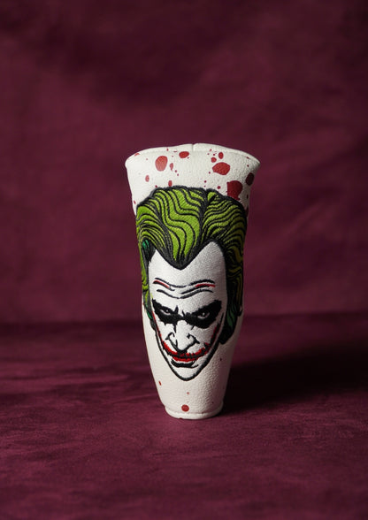 Blade headcover with a Joker design on a maroon background