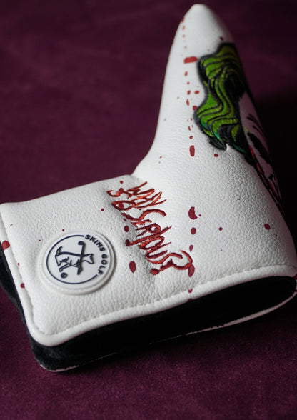 White golf club head cover with red text and green Joker on a purple background