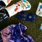 Golf club heads with decorative covers on a grassy background