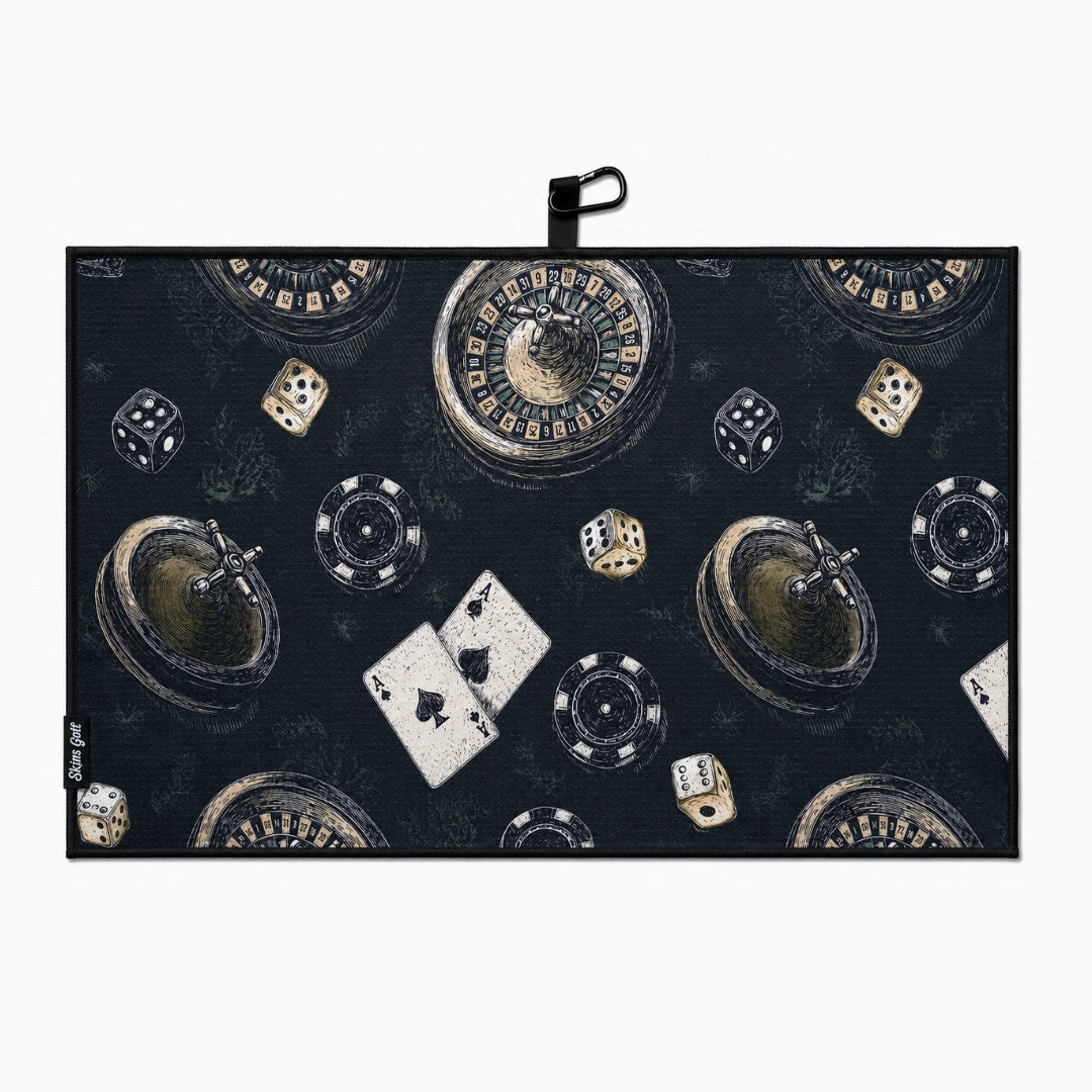 Casino-themed golf towel with roulette, dice, cards, and chips on a dark background