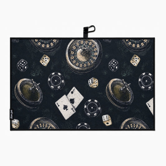 Casino-themed golf towel with roulette, dice, cards, and chips on a dark background