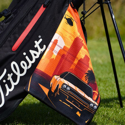 car on golf towel hanging on bag