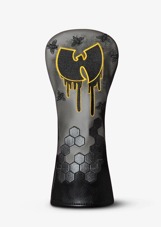A golf club headcover with a dark gray and black gradient design, featuring a dripping yellow Wu-Tang Clan-style logo and small bee motifs on a light gray background.