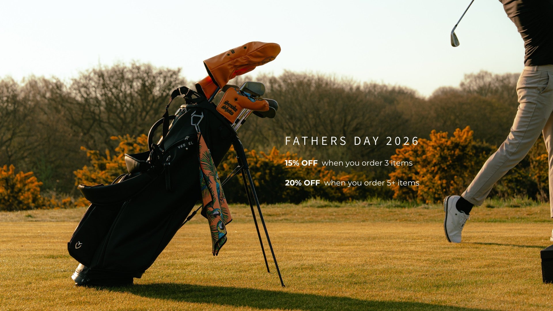 Golf bag with clubs on a golf course, promotional text for Fathers Day 2026 sale.