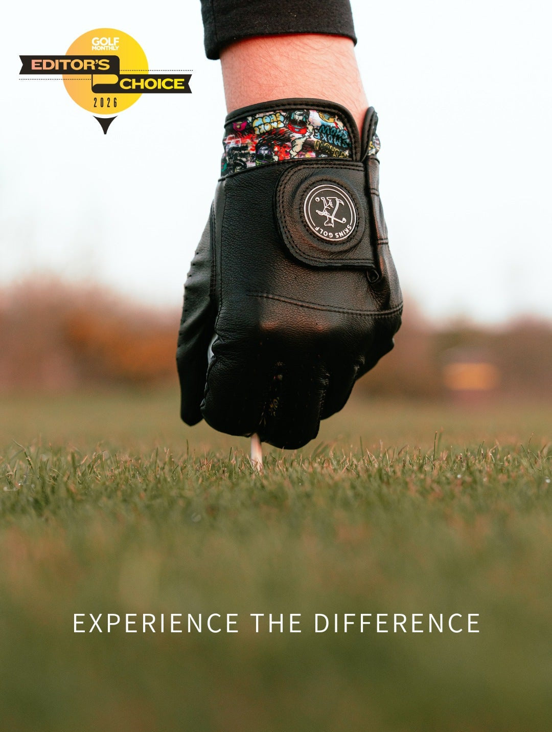 Golf glove held in a hand on a blurred golf course background with 'Editors' Choice' badge and text 'Experience the Difference'.