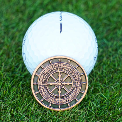 Golf ball with a roulette wheel on grass