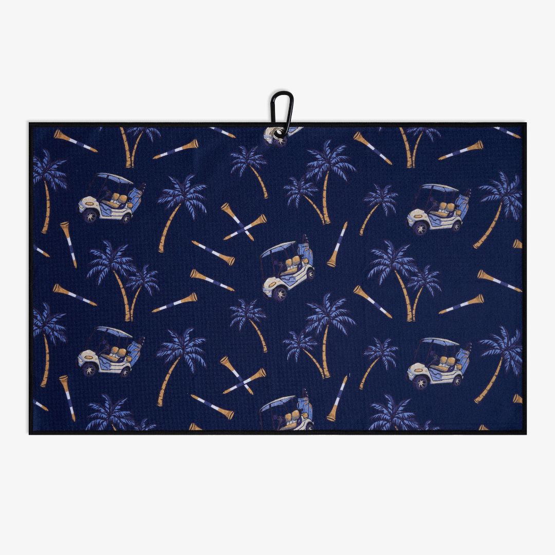 Navy blue towel with palm tree and golf cart pattern on a white background