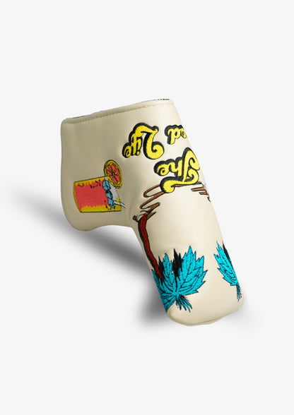 Beige golf club head cover with colorful designs on a white background