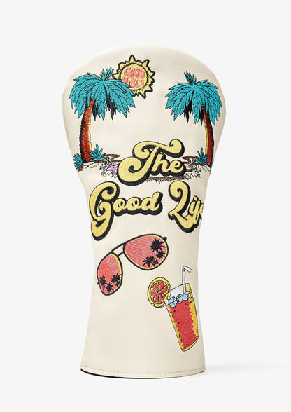 Golf club head cover with 'The Good Life' text and tropical designs on a white background