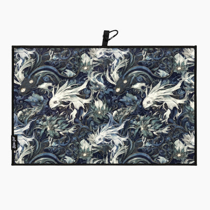 Decorative golf towel with fish pattern on a white background