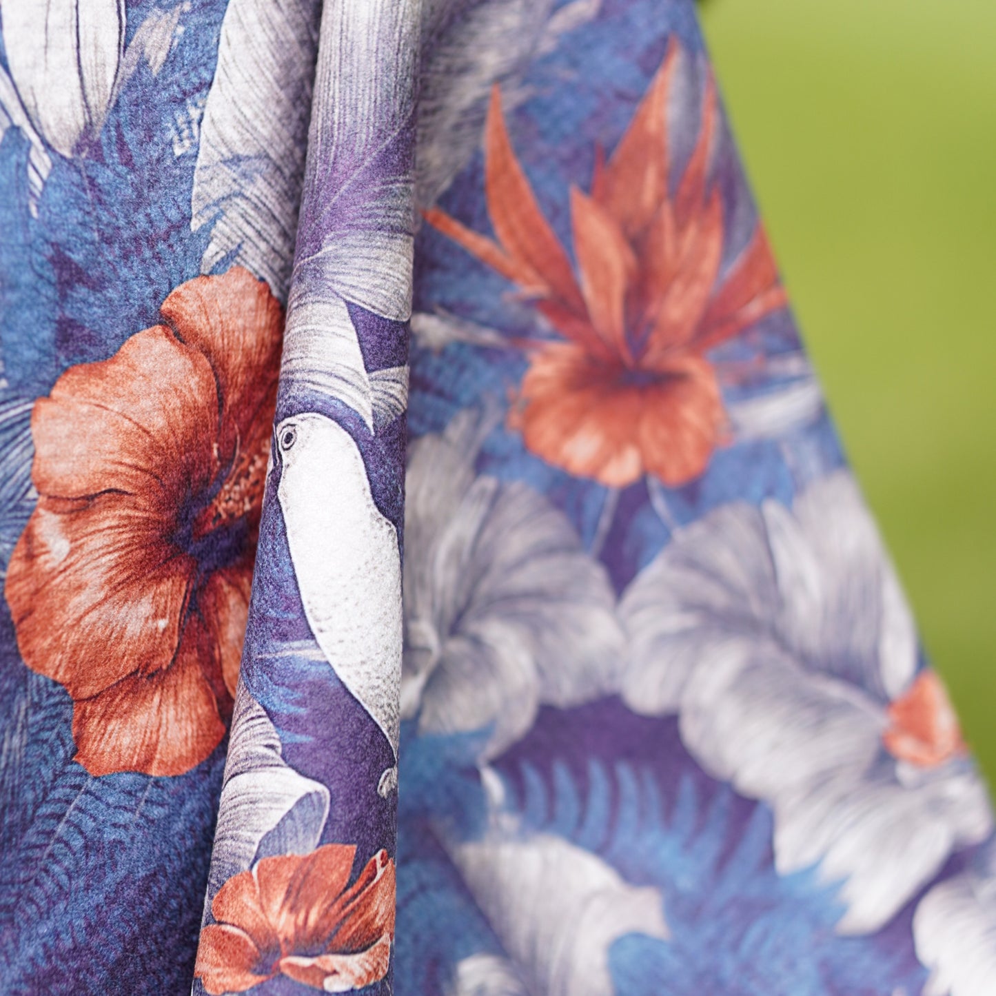 Close-up of fabric with floral pattern on a green background