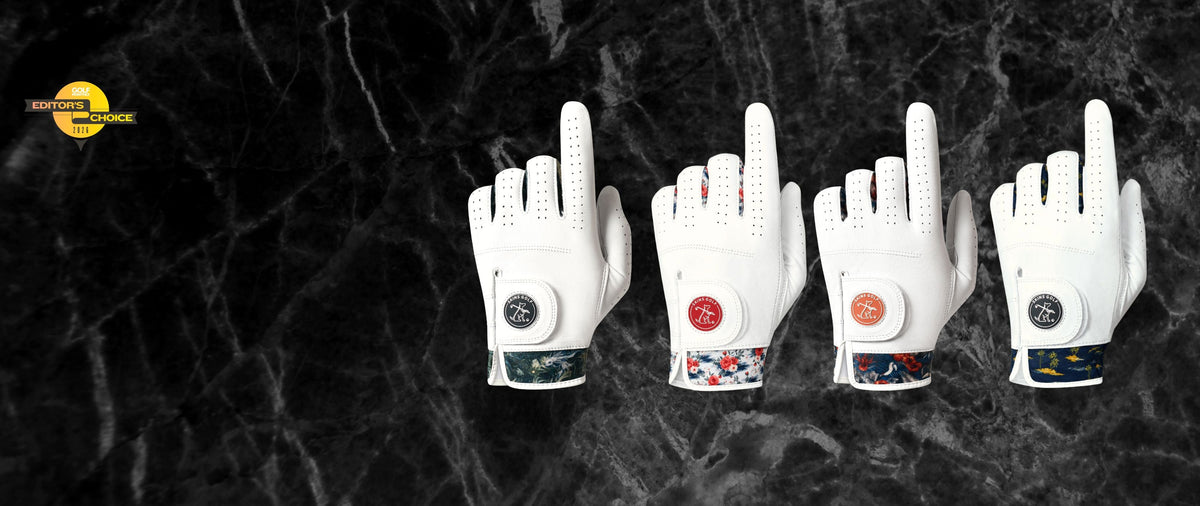 Four white golf gloves arranged in a row on a dark marble background, each with a circular dial closure and different wrist strap patterns. A yellow logo for 'The Golf Store' is visible in the top-left corner.